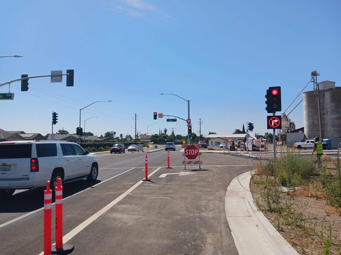 Intersection with traffic lights and stop sign.