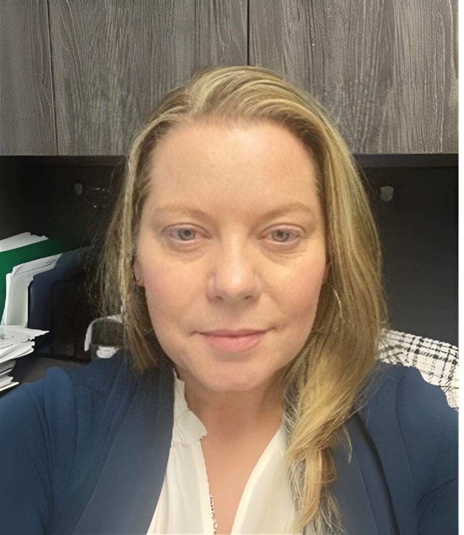 Woman sitting in an office environment.