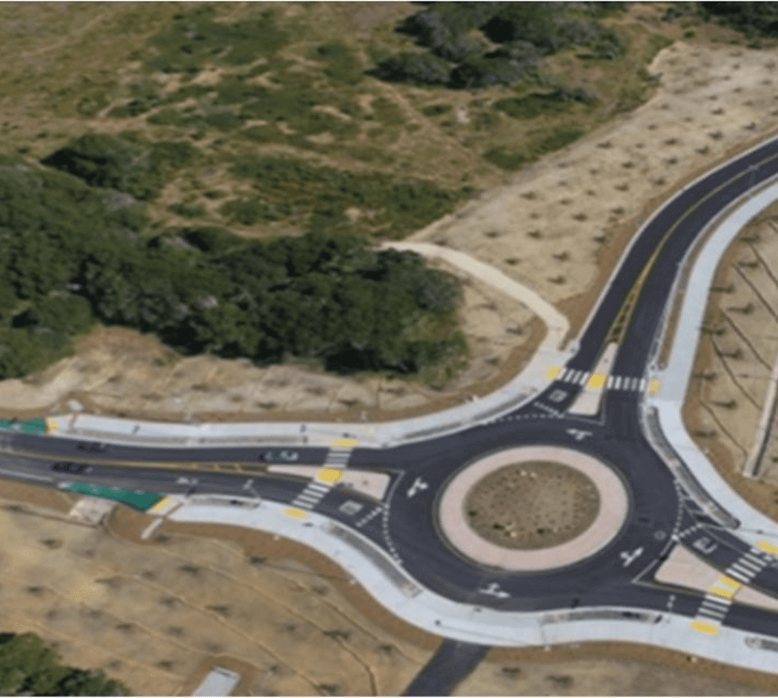 Aerial view of a roundabout with trees.