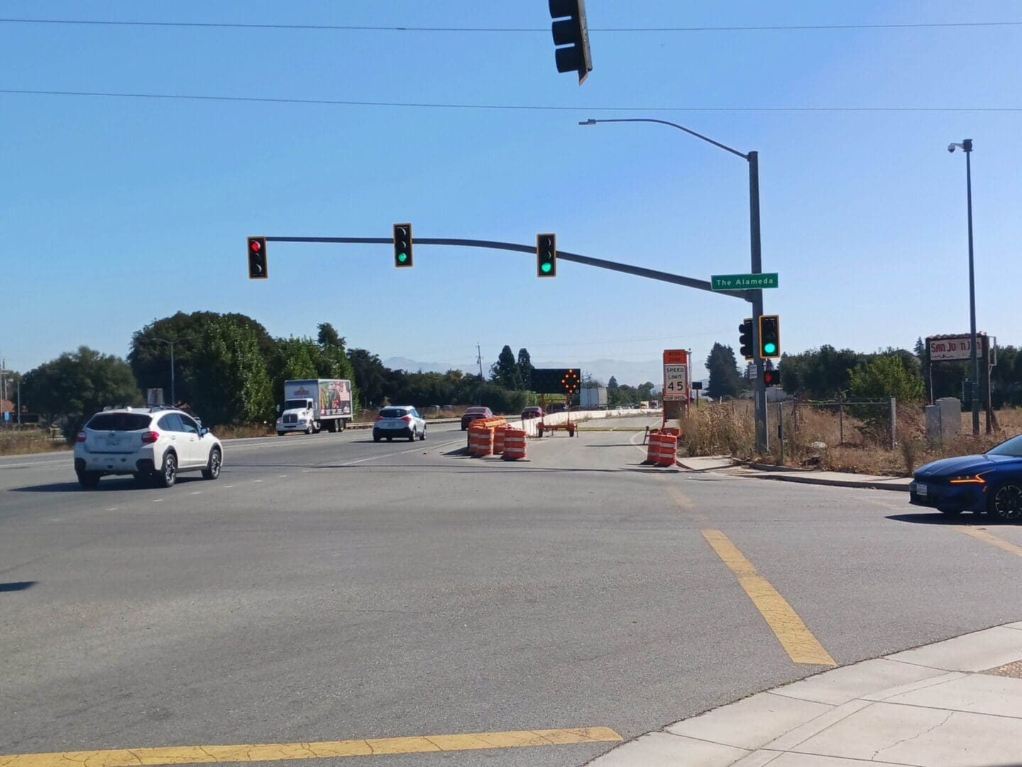 Traffic lights at intersection with road construction.