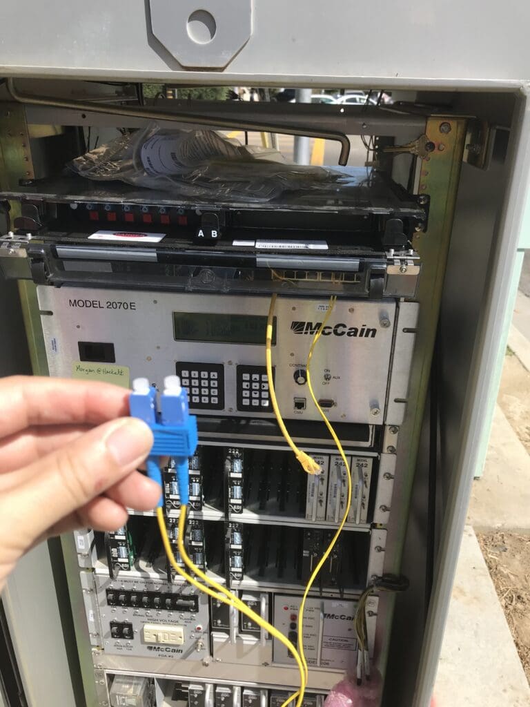 Traffic control cabinet with fiber optic cables.